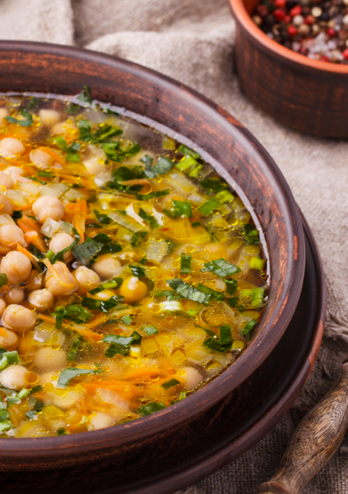 Italian Herb & Chickpea Soup in a wooden bowl.
